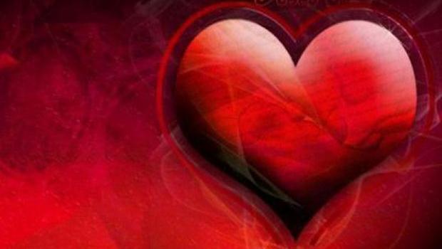 Coeur en 3D sur font rouge