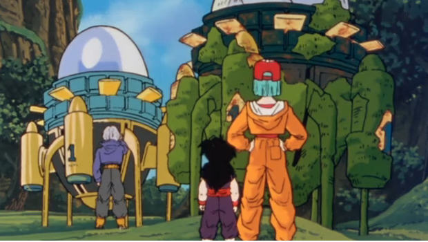 Gohan, Bulma et Trunks devant les deux machines à voyager dans le temps