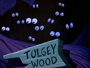 yeux dans le noir des créatures de la forêt d'alice au pays de smerveilles ou bois de tulgey